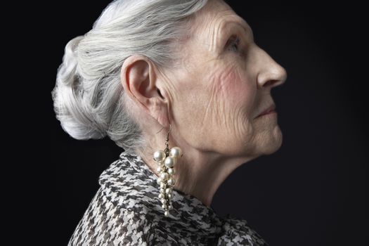 Senior Woman with Pearl Earrings
