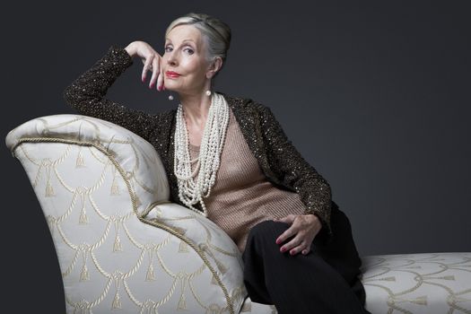 Wealthy Senior Woman on Chaise Lounge