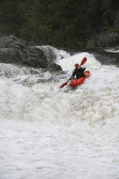 Portrait of Man kayaking in river