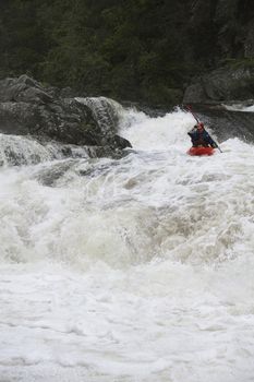 Portrait of Man kayaking in river