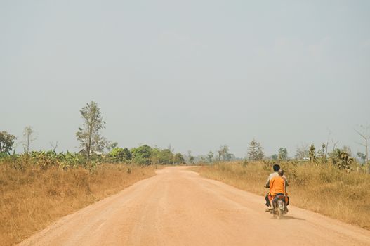 Man riding motorbike on road