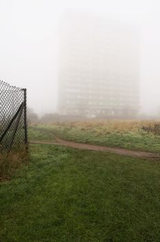 Block of flats hidden behind fog