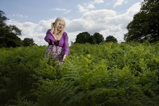 Woman Walking in a Meadow of Ferns