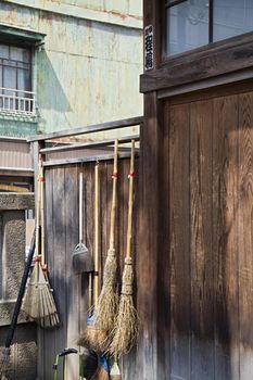 Straw Brooms on Fence at Shitaya Jinja Shinto Shrine