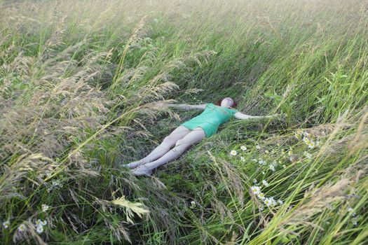 Woman Lying in Tall Grass