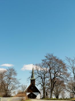 Rural church surrounded by bare trees