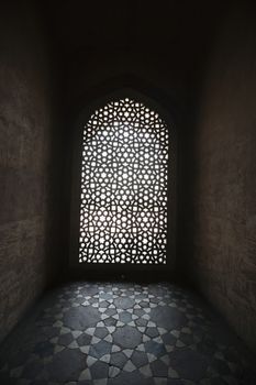 Light coming through stone lattice at Humayun's Tomb, New Delhi, India
