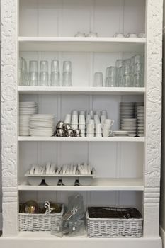 Tableware arranged in shelf