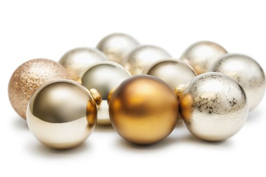 Group of shiny Christmas baubles against white background