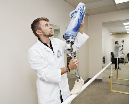Young technician with advanced prosthetic foot