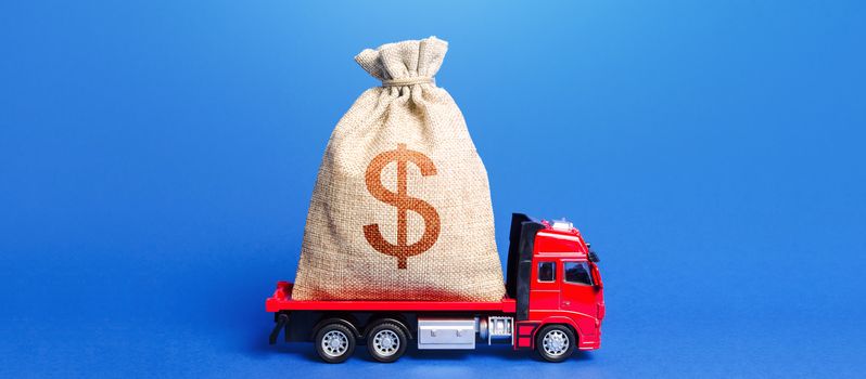 The truck is carrying a huge dollar money bag. Great investment. Attracting large funds to the economy for subsidies, support and cheap soft loans for businesses. Anti-crisis measures of government.