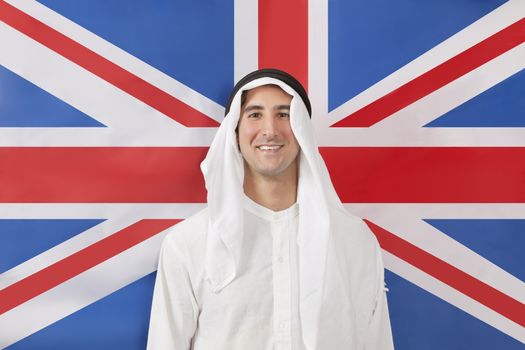 Portrait of an Arab man in traditional clothes against United kingdom flag
