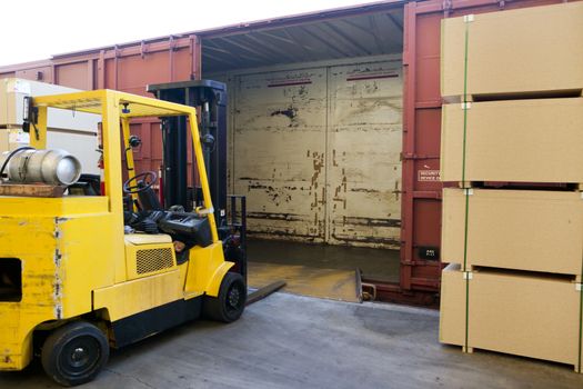 Fork Lift Truck loading industrial railway carriage