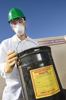 Safety inspector holding hazardous waste