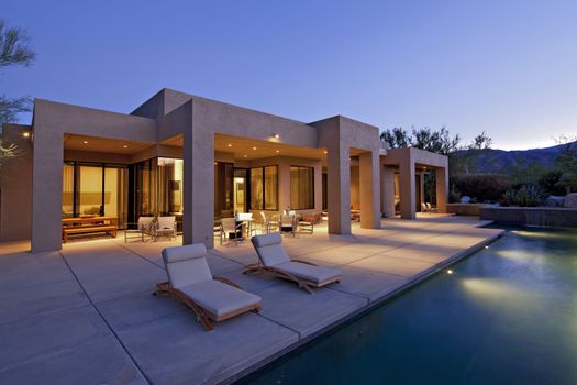 House exterior with pool at dusk