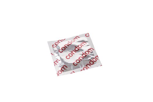 Condom packet over white background