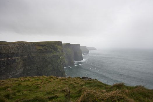 Misty view over Cliffs of Moher