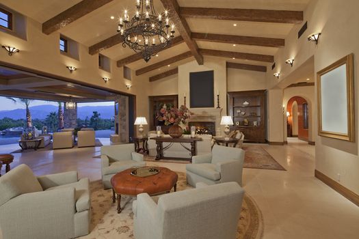 Interior of large open plan living room opening to patio