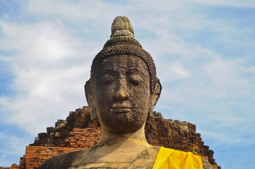 Peaceful face of Buddha ancient statue in Ayudhaya Thailand
