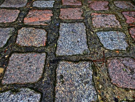 Perspective view at on old historical cobblestone roads and walk