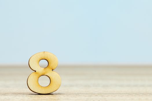 Wooden numeric on table ,number eight