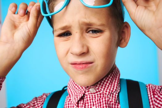 Schoolboy glasses backpack training dissatisfaction