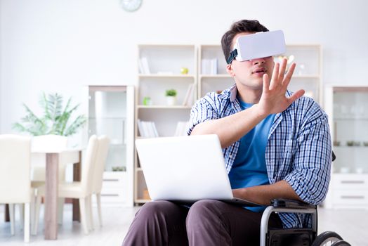 Freelance student studying with laptop and virtual reality glass
