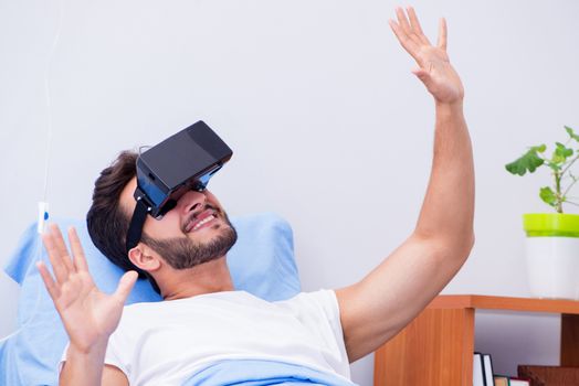 Patient in the hospital with VR glasses headset