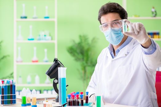 Man chemist working in the lab