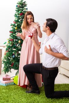 Man making marriage proposal at christmas day