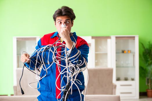 Electrician contractor with tangled cables