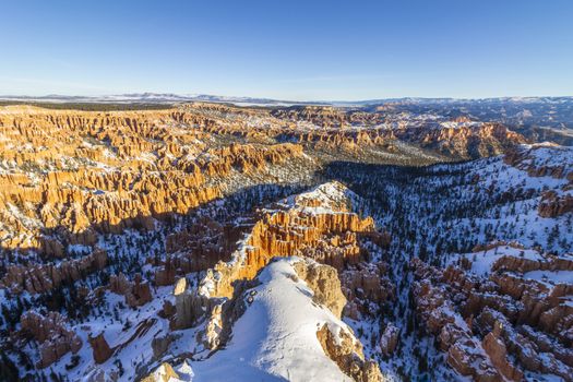 Bryce Canyon Hoodoos at Sunrise in Winter on Sunny Morning. Snow
