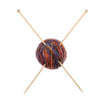 A ball of wool and knitting needles making a cross