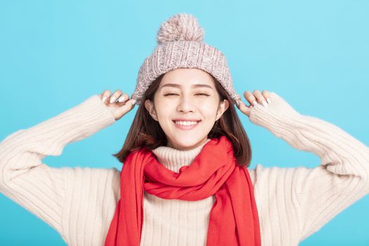 happy young asian woman wearing stylish warm clothes