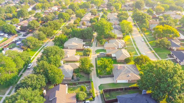 Bird eye view clean and peaceful neighborhood streets with row of single family homes near Dallas, Texas, USA