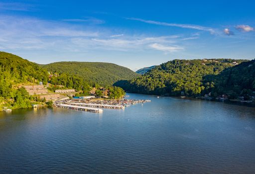 Wide panorama of Cheat Lake on a summer evening with boats docked in marina