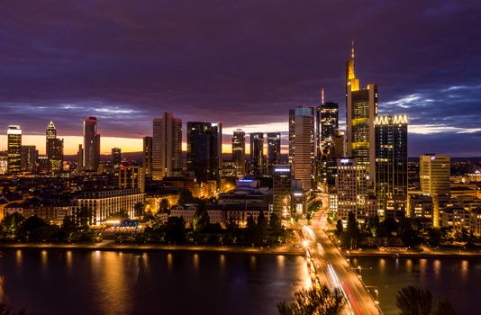 Wide View of Frankfurt am Main Skyline at Night with Main River in foreground and City Lights in Frankfurt, Germany 2019