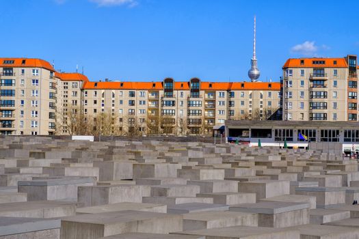 Holocaust Memorial museum and Berlin city skyline in daylight, B