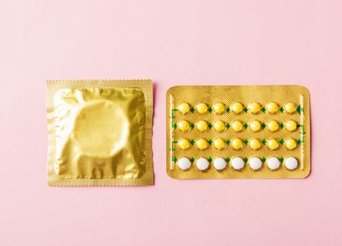 Condom in wrapper pack and contraceptive pills blister
