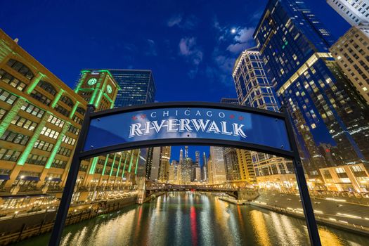 The landmark Chicago riverwalk label over cityscape river side,