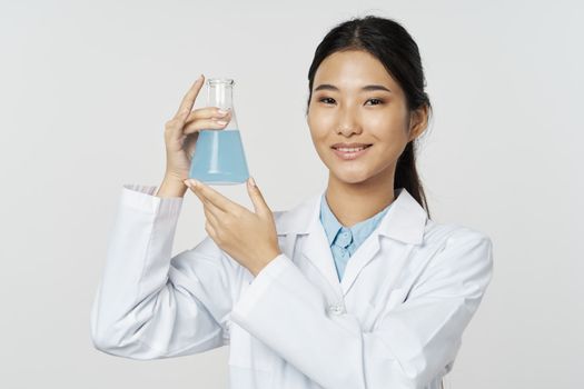 Female doctor white coat laboratory chemical solution analyzes