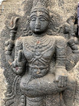 Bas relief sculpture of Hinu God carved in the stone walls of Shiva temple, Tamil nadu