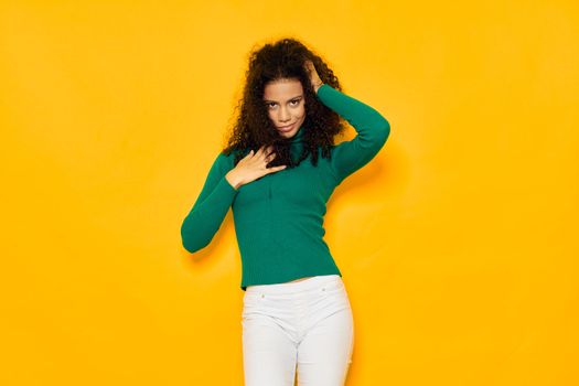 Woman with black curly hair glamor green blouse