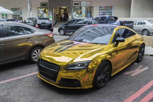 Golden luxury sports car in Kuala Lumpur, Malaysia.
