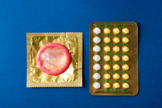 condom on wrapper pack and contraceptive pills blister hormonal 