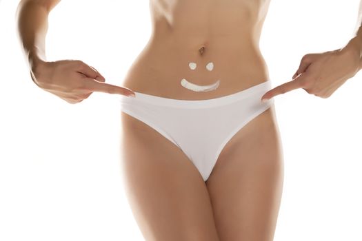 woman with happy expression drawn on her belly