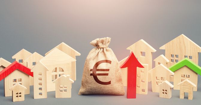 Euro money bag and a city of house figures and red up arrow. Recovery and growth in property prices, high demand. Increase in revenues to municipal budget. Increase in rent. Investments.
