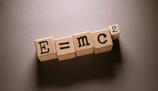 E = mc 2 Word with Wooden Cubes