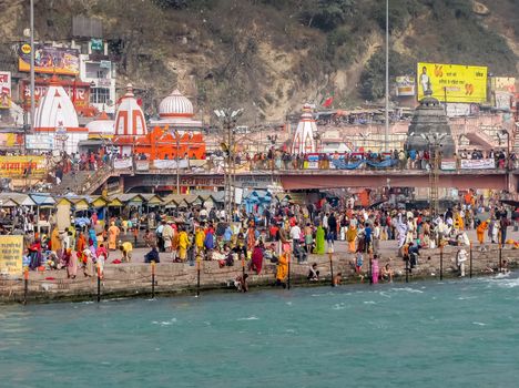 Crowd taking bath in Ganges & performing rituals at Ganga Ghat