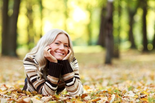 Woman in autumn park